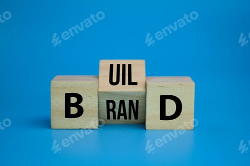 Preview: wooden cube with the word Build your brand symbol.
