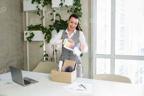 Preview: Dismissal. Fired frustrated employee woman packing belongings in cardboard box leaving workplace.