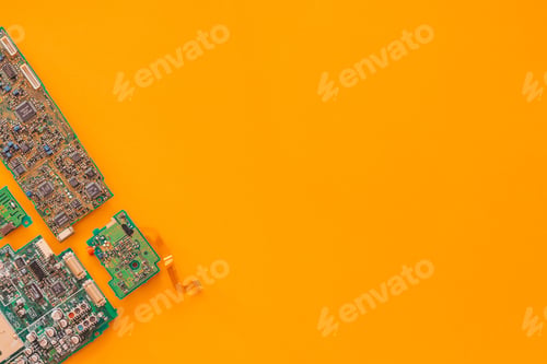 Preview: Flat lay of some motherboards against a yellow background