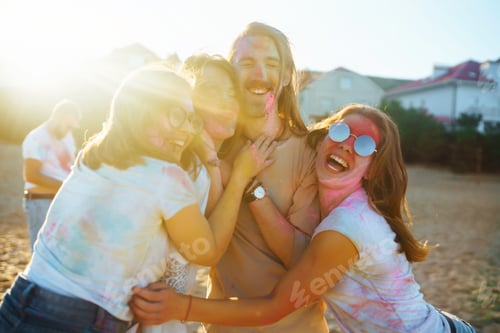 Preview: Group of friends have fun, dance at holi festival. traditional indian spring holiday. Friendship.