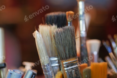 Preview: Paints and paint brushes in an artists studio.