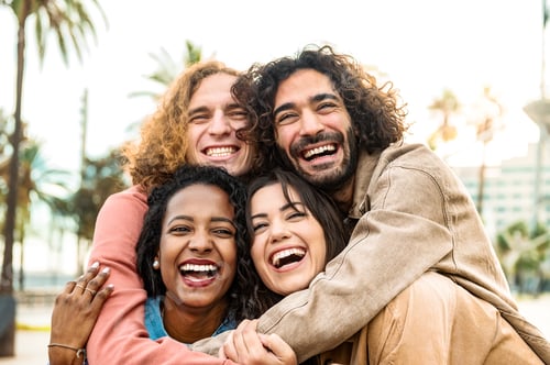 Preview: Multiracial group of friends smiling together and taking selfie pic with smart mobile phone device