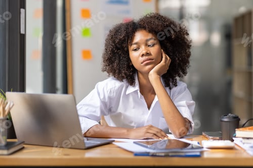 Preview: Portrait of tired young business african american woman work with documents tax laptop computer in