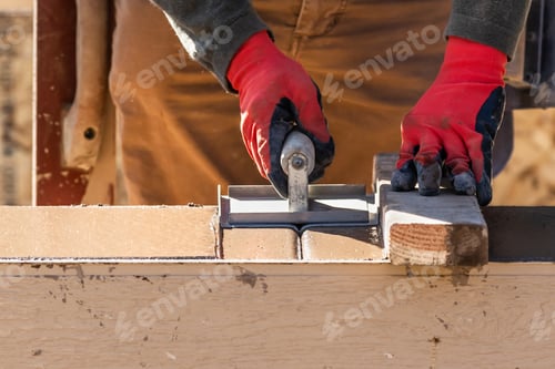 Preview: Construction Worker Using Hand Groover On Wet Cement Forming Coping Around New Pool