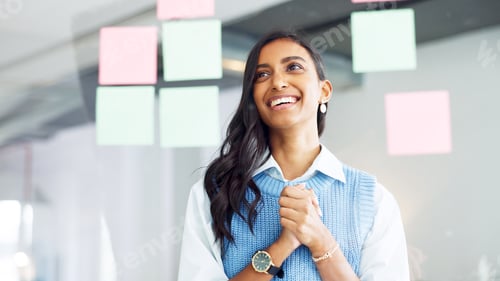 Preview: Young business woman brainstorming and planning a mind map with ideas on sticky notes on a glass wa