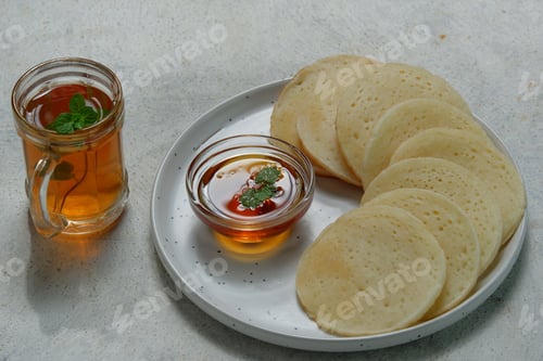 Preview: Moroccan pancakes, Arabic pancakes - Baghrir served with honey and mint tea