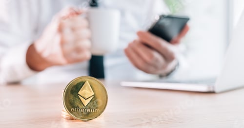 Preview: Businessman trading with Ethereum cryptocurrency commerce platform over his laptop and smartphone