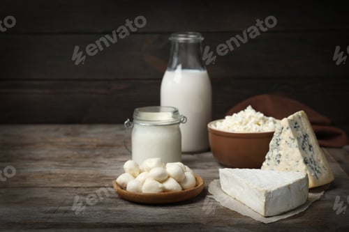 Preview: Different fresh dairy products on wooden table