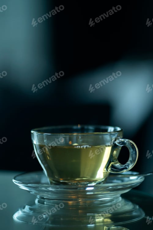 Preview: Vertical shot of a cup of green tea