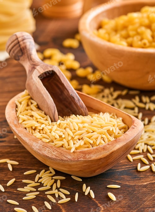 Preview: Ptititm or israeli couscous - kind of small pasta, traditional for israelian cuisine on an old woode
