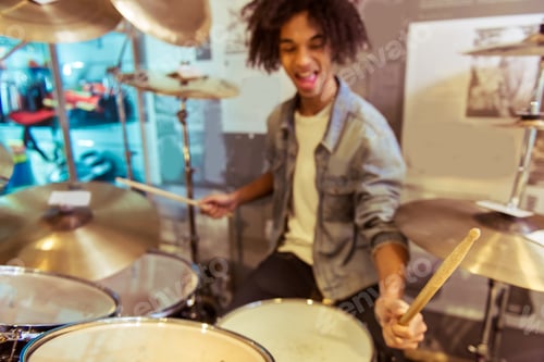 Preview: Energetic Drummer Playing Set in Music Store