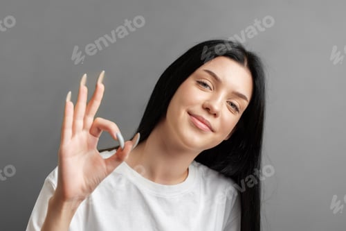 Preview: Portrait of a young girl who rejoices in success.