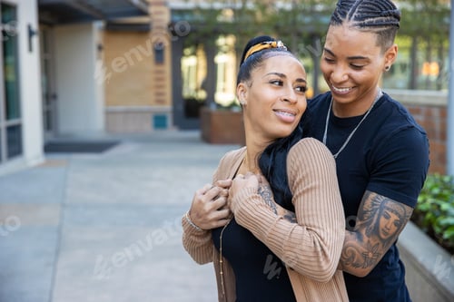 Preview: Young African American lesbian couple close together