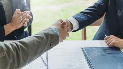 Preview: Business success. Businessman shaking hands agreement confirmed in the investment business.