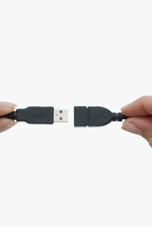 Preview: Close up of woman using USB cord