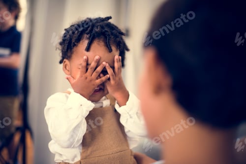 Preview: Young cheerful black kid with family