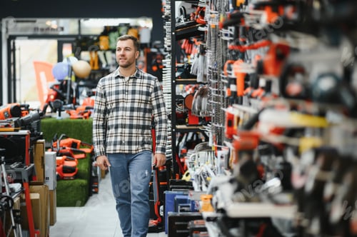 Preview: A man chooses a power tool in a hardware store