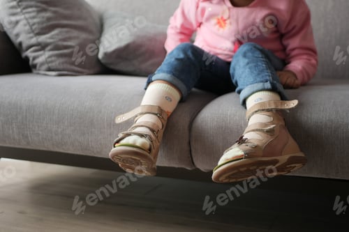 Preview: Child cerebral palsy disability, legs orthosis.