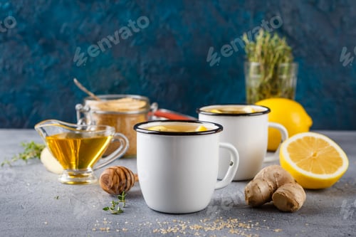 Preview: Cups of ginger tea with honey and lemon
