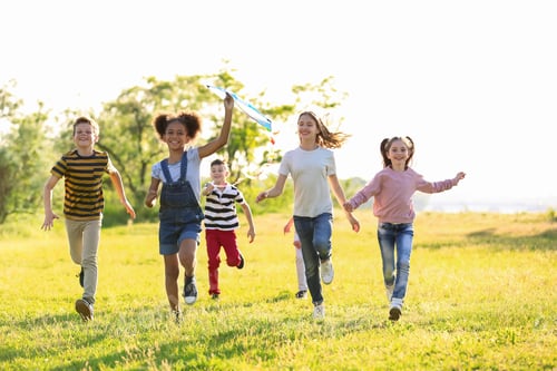 Preview: Cute little children playing with kite outdoors on sunny day
