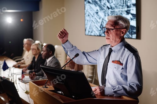 Preview: Speaker speaking in microphone at conference