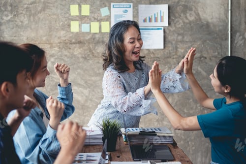 Preview: Group of Asian businesspeople raising their hands, rejoicing with the achievements as set forth