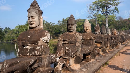 Preview: the row of stone statues that line the walkway over the lake are all statues