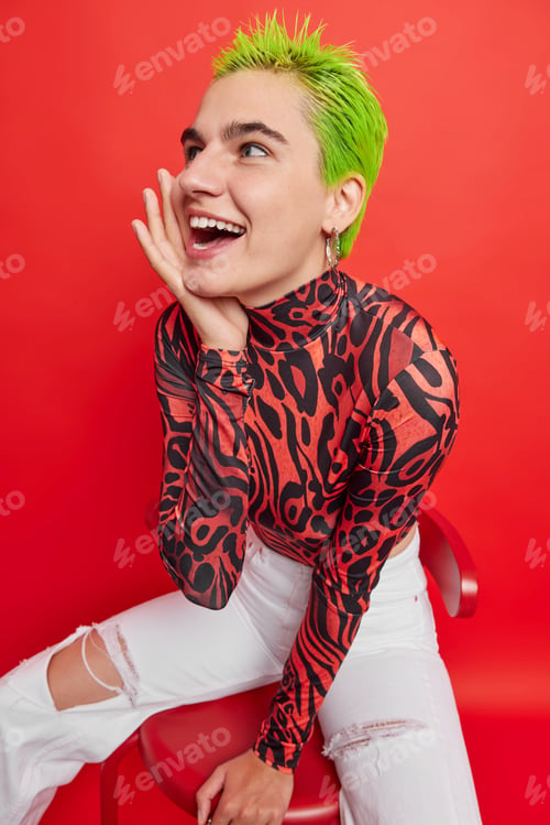 Preview: Vertical shot of hipster girl belongs to youth subculture has fun with teenagers friends separates h