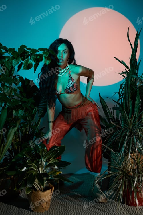Preview: Captivating summer vibes with a stylish young woman in a vibrant botanical setting