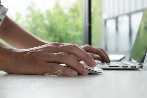 Preview: Hand are using the mouse and keyboard.