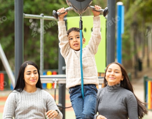 Preview: Front view os hispanic lesbian family with their son enjoying the zip line