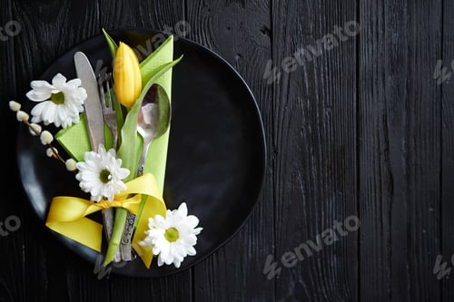 Preview: Easter spring table dishware composition with yellow tulip flower