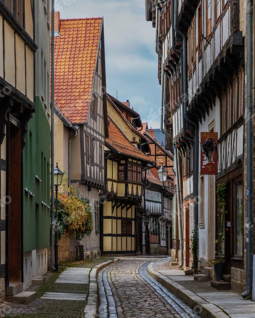 Preview: Narrow cobblestone street in Quedlinburg lined with historical buildings