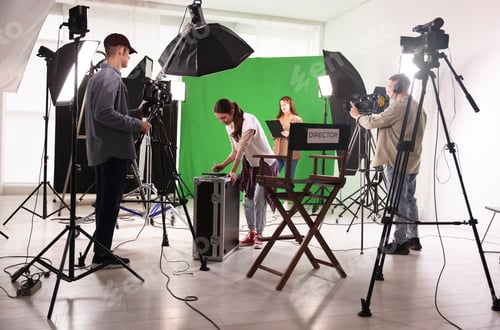 Preview: Group of people working in modern film studio