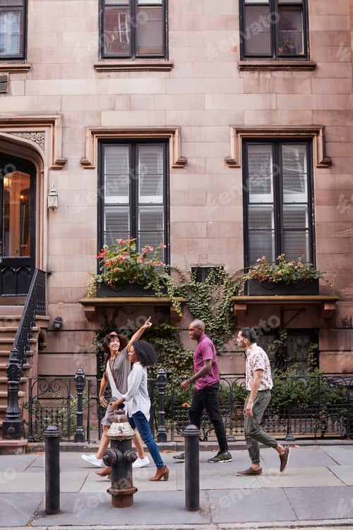 Preview: Group Of Friends Walking Along Urban Street In New York City