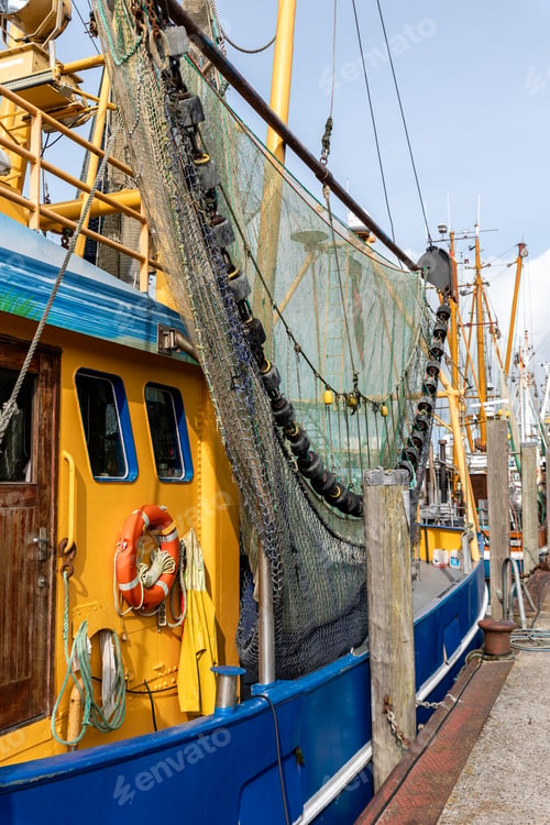 Preview: Colorful traditional old german fishing cutter boats moored Neuharlingersiel harbor Wadden sea East