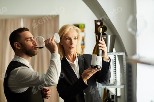 Preview: Sommelier Holding Wine Bottle