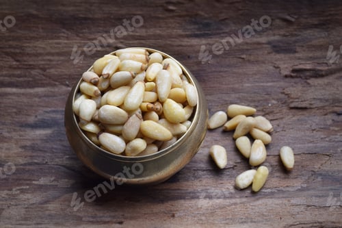 Preview: Pine nuts on a wooden table