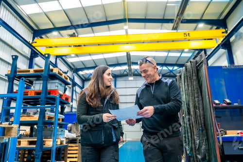 Preview: Team of engineers working in a cnc logistics factory