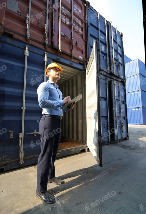 Preview: Engineer or supervisor checking and control loading Containers box from Cargo at harbor. Foreman con