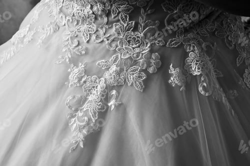 Preview: Black and white shot of a lace wedding dress