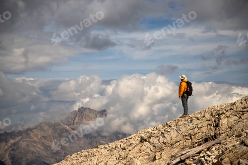 Preview: Hiker enjoys the view from Lagazuoi mountain over the italian Dolomites.