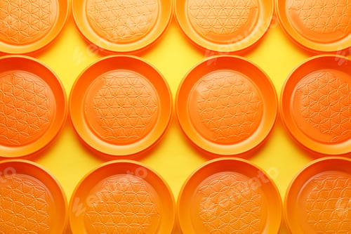 Preview: Plastic plates on color background, top view. Picnic table setting