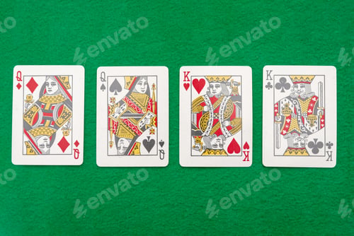 Preview: Four playing cards featuring queens and kings on green felt table