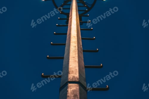 Preview: Low angle view of light pole at night