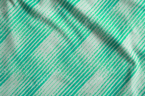 Preview: Close up of green football jersey sports clothing fabric texture.