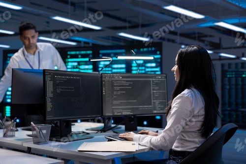 Preview: Software developer using computer, optimizing data center performance