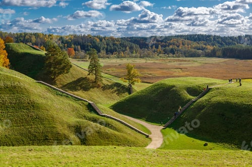 Preview: Calm autumn day in Kernave, Lithuania, featuring a walking trail and gentle hills