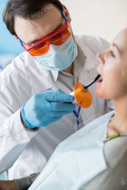 Preview: Dentist taking care of woman