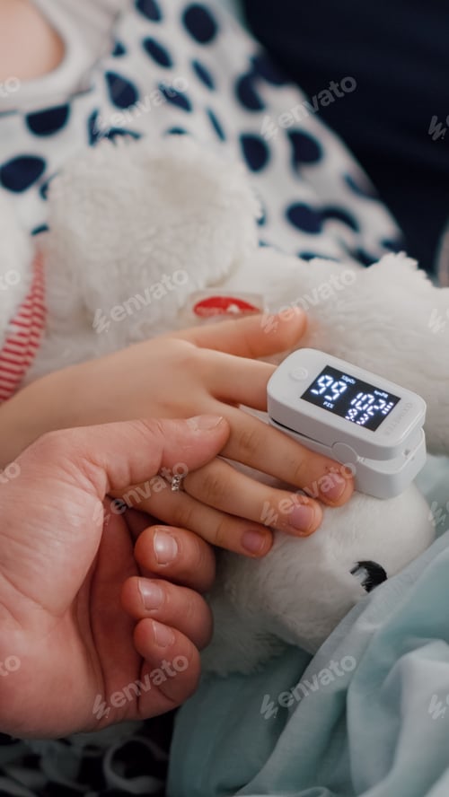 Preview: Close up of father holding sick daughter hands after suffering medical surgery against sickness
